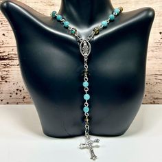 Handmade Rosary Necklace With Blue Jade & Crystal Quartz! This Gorgeous Rosary Necklace Features Eye-Catching 6mm Crystal Quartz And 6mm Blue Jade Stones! The Cross Pendant And Virgin Link Are Made From Durable Alloy With Antique Silver Finish. Both Pieces Are Hypoallergenic And Tarnish-Resistant. The Hand-Linked Wire Is 18 Gauge Silver Over Copper. This Rosary Necklace Is Stunningly Beautiful And Very Unique! Definitely One Of A Kind! Enjoy! Ps 25% Off 3 Or More Items From My Closet! Every Orde Blue 8mm Bead Jewelry For Gift, Blue 8mm Beads Jewelry For Gift, Blue Jewelry With 8mm Beads As Gift, Blue Nickel-free Crystal Necklace As Gift, Blue Necklaces With 8mm Beads For Jewelry Making, Blue Necklaces With 8mm Beads For Gift, Blue Necklaces With 8mm Beads As A Gift, Elephant Charm Necklace, Handmade Rosary