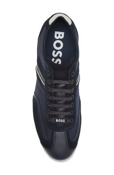 A contrasting low-top sneaker with a brand logo detail offers a refined take on sporting classic. Lace-up style   Leather upper/textile lining/rubber sole   Imported   Hugo Boss/BOSS/HUGO has received the Fair Labor Association accreditation, which signifies that the company has effective systems and procedures in place to successfully uphold fair labor standards throughout its supply chains, including strategies and tools to address and improve working conditions Sporty High-top Sneakers With Logo Detail, Custom Low-top Sneakers With Logo For Sports, Sporty Custom Sneakers With Logo Detail For Streetwear, Modern Low-top Nylon Sneakers, Athleisure Sneakers With Logo For Sports, Athleisure Sneakers With Logo Detail For Sports, Athleisure Lace-up Sneakers With Logo Print, Low-top Athleisure Sneakers With Logo Print, Low-top Logo Print Sneakers For Athleisure