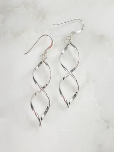 Women's Sterling Silver Swirl Dangle Earrings Details Sterling Silver 2.25" Dangle Earrings for Pierced Ears Elegant Swirl Earrings As Gift, Elegant Swirl Earrings For Gift, Elegant Swirl Earrings, Sterling Silver Spiral Earrings For Formal Occasions, Nickel Free Jewelry With A Modern Twist, Formal Sterling Silver Spiral Earrings, Elegant Swirl Earrings With Ear Wire, Modern Twist Silver Teardrop Jewelry, Elegant Swirl Ear Wire Earrings