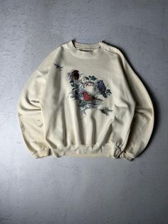 Vintage Birds Crewneck Sweatshirt - Women's Medium, Retro Graphic Pullover, Classic Cozy Wear, Timeless Casual Style Size On Label: N/A Recommended Size: Women's Medium Measurements: Pit-to-Pit: 22" Length: 24" *Signs of wear present, please check additional picture(s) for more info Cream Tops For Winter Streetwear, Relaxed Fit Cream Sweater With Graphic Print, Beige Graphic Print Top For Winter, Winter Cream Tops With Graphic Print, Winter Graphic Print Cream Tops, Winter Cream Graphic Print Tops, Cream Graphic Print Sweater Relaxed Fit, Vintage White Sweatshirt With Graphic Print, Vintage Sweatshirt With Kangaroo Pocket