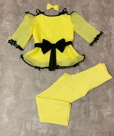 Yellow girls suit with blouse and pants and black trim/ Interview outfit/ Girls casual wear/ Pageant dress/ Casual outfit/ Custom suit This beautiful suit is made from polyester fabric. This material is stretchy and very soft. It looks amazing with sleeves and peplum from organza fabric. The bows make the dress unique. It is easy to care and comfortable to wear. The dress is perfect for every important event and as a casual wear. It is absolutely stunning on! Materials Organza, polyester Colors Fitted Sets For School Spring Season, Spring School Fitted Sets, Fitted Spring Sets For School, Yellow Stretch Sets For Party, Black Matching Set For Party, Fitted Long Sleeve Dress-up Sets, Fitted Sets For Dress-up In Spring, Fitted Sets For Spring Dress-up, Fitted Sets For Dress-up Occasions In Spring