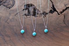 A small turquoise circle pendant hangs from a dainty, tarnish resistant silver chain. Matching earrings can be found here:https://www.etsy.com/listing/637026761/turquoise-stud-earrings-tiny-studAll metal is hypoallergenic stainless steel. Stainless steel is my preferred material for many reasons. It is low maintenance and long lasting, resistant to rust and oxidation. It also will not chip as silver and gold plated materials will. It is a sturdier, harder metal that will endure the test of time Cheap Turquoise Necklace With Tiny Beads, Dainty Turquoise Necklace, Minimalist Turquoise Round Pendant Necklace, Turquoise Jewellery, Turquoise Stud Earrings, Silver Circle, Tiny Stud Earrings, Sea Glass Necklace, Emerald Engagement