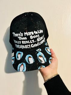 This is an adjustable black hat with hand drawn design with the movie quote from Zoolander. It takes up to one week to be finished and shipped out.  Please allow me time to fix any issues, I will be making sure it's in its best condition possible to be shipped to its new owner.  Remember everything is hand made with acrylic paint and or fabric markers and sealed with a matte finish. Hand wash only.  Thank you for supporting a small business! Materials Used: George Brand Caps and Acrylic paint Funny Black Trucker Hat With Letter Print, Black Baseball Cap With Graphic Print, Black Graphic Print Hat For Streetwear, Black Fun Snapback Hat With Curved Brim, Funny Black Snapback Trucker Hat, Black Casual Trucker Hat With Graphic Print, Novelty Black Hat With Letter Print, Fun Black Baseball Cap With Letter Print, Black Novelty Hat With Letter Print