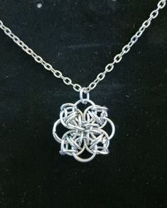 Celtic Knot Pendant Necklace Unique Metal Chain Necklace As Gift, Handmade Silver Dangle Chain Necklace, Handmade Metal Chain Necklace Gift, Handmade Metal Chain Necklace For Gift, Metal Square Pendant Jewelry With Chain, Metal Flower Pendant Costume Jewelry, Silver Flower Pendant Costume Jewelry, Stainless Steel Large Pendant Necklaces, Metal Necklaces With Flower Pendant And Chain