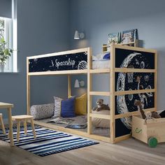 a child's bedroom with bunk beds and toys on the floor in front of it