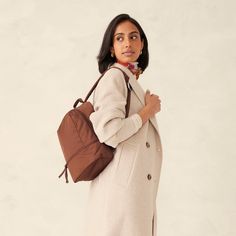 Discover the perfect blend of style and functionality with our Small Chancery Backpack. Designed for the modern woman on the go, this versatile backpack offers the convenience of a backpack with the stylish and sophisticated look of a purse, making it the ideal accessory for work, travel and everyday use. Upgrade your daily carry with our Small Chancery Backpack. Whether you're heading to the office, traveling or running errands, our backpack offers the perfect combination of style, comfort and Elegant Backpack With Leather Handles For On-the-go, Brown On-the-go Bag With Adjustable Straps, Modern Brown Backpack For On-the-go, Modern Backpack With Zipper Closure And Double Handle, Trendy Travel Backpack Tote, Modern Everyday Backpack With Double Handle, Trendy Travel Tote Backpack, Trendy Tote Backpack For Travel, Versatile Backpack With Removable Pouch For Daily Use