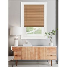 a living room scene with focus on the window and blinds in the windowshade