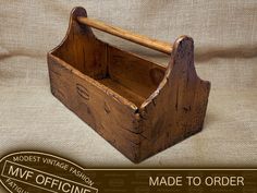 an old wooden box with a handle on the front and bottom, made to order