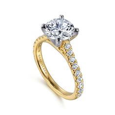 Elevate your love story with our stunning 14K White-Yellow Gold Round Diamond Engagement Ring. This exquisite piece features a brilliant round diamond, expertly set to maximize its sparkle and brilliance. The unique two-tone gold band beautifully contrasts the radiant diamond, offering a modern yet timeless appeal. *Setting only, center stone not included Multi Stone Engagement Ring, Round Diamond Engagement Rings Yellow Gold, Diamond Cuff Bracelet, Round Diamond Engagement Ring, Gold Rings Stackable, Diamond Fashion Rings, Stone Engagement Ring, Radiant Diamond, Round Diamond Engagement Rings