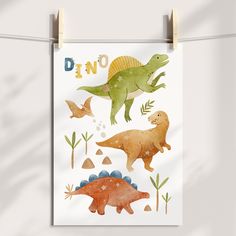 a poster hanging on a clothes line with dinosaurs and plants in watercolor style