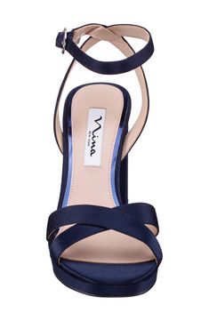 Crisscrossing vamp straps and a lustrous upper create modern allure on an elegant sandal lifted by a wrapped block heel. Adjustable ankle strap with buckle closure Synthetic upper and lining/leather sole Imported Formal Sandals With 4-inch Heel And Cross Strap, Formal Heels With Heel And Cross Strap, Evening Sandals With 4-inch Heel And Cross Strap, Formal Cross Strap Sandals With Padded Heel, Chic Cross Strap Heels For Formal Occasions, Evening Sandals With Cross Strap And Heel Loop, Evening Sandals With Heel Loop And Cross Strap, Elegant Cross Strap Sandals With Padded Heel, Chic Evening Sandals With Cross Strap