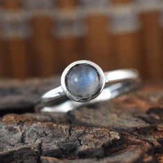 Beautiful Bold handmade sterling silver natural Rainbow Moonstone Ring, made with finest White Rainbow Round natural Rainbow Moonstone hand set to perfect Bezel setting. All Designs are original. Stone - Rainbow Moonstone Stone Shape - Round Size Available - 7.0 US Setting - Bezel This is a classy fine hand-crafted sturdy Rainbow Moonstone Ring This Rainbow Moonstone Ring is great for casual or dressy wear This Ring is for women You will receive a Ring like the one in the pictures This Ring have Moonstone Stone, Rainbow Moonstone Ring, White Rainbow, Natural Rainbow, Moonstone Ring, Ring Engagement, Jewelry Rings Engagement, Birthstone Ring, Ring Jewelry