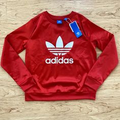 Adidas Women's Red Trefoil Satin Logo Long Sleeve Sweatshirt Nwt Size S Red Logo Print Sweatshirt For Fall, Fall Red Sweatshirt With Logo Print, Adidas Logo Print Tops For Fall, Adidas Red Winter Tops, Adidas Long Sleeve Top With Logo Print, Red Adidas Tops For Winter, Red Crew Neck Tops For Winter, Adidas Tops With Graphic Print For Fall, Adidas Crew Neck Tops For Winter