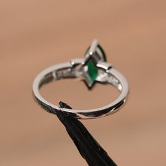 It is a lab emerald ring. The main stone is 5mm*10mm marquise cut, weight about 0.82 carats. The basic metal is sterling silver and plated with rhodium. To change the metal to a solid gold (white/rose) or platinum is also available, please ask for a quotation if you want. You can also go to my shop Home for more elegant rings: https://www.etsy.com/shop/godjewelry?ref=hdr_shop_menu More emerald rings: https://www.etsy.com/shop/godjewelry?section_id=20709240 Customization is always welcome and ple Engagement Ring Types, Elegant Rings, Smaragd Ring, Emerald Rings, Green Emerald Ring, Silver Engagement Ring, Cz Rings Engagement, Sterling Silver Engagement Rings, May Birthstone