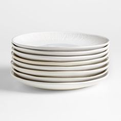 white plates stacked on top of each other