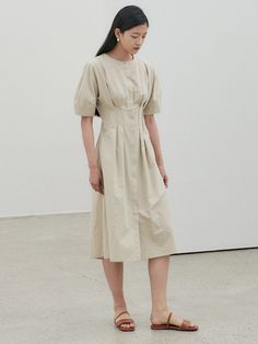 Editor's Notes The dress is made with a mix of linen and has a feminine silhouette. - Tuck that accentuates the waist- Voluminous sleeves- Neat and feminine mood- Hidden closing at the frontMeasurements(in.)34 / 36- Side Neck - Sleeve Hem: 15.94 in. / 16.34 in.- Chest: 16.14 in. / 17.13 in.- Waist: 13.19 in. / 14.17 in.- Sleeve Width: 8.27 in. / 8.46 in.- Total Length: 44.88 in. / 45.47 in.*There may be Â±5% of error depending on each product*There may be errors Classic Beige Dress With Pleated Waist, Beige A-line Midi Dress With Pleated Waist, Classic Beige Dresses With Pleated Waist, Classic Pleated Beige Midi Dress, Classic Beige Pleated Midi Dress, Chic Beige Midi Dress With Pleated Waist, Beige Classic Midi Dress For Daywear, Elegant Beige Linen Workwear Dress, Classic Beige Dresses For Daywear