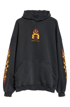 Balenciaga's Burning Unity logo flames across a distressed cotton hoodie designed with dramatically dropped shoulders in a slouchy, oversized fit. 28" length (size 2) Fixed hood Long sleeves Kangaroo pocket Ribbed cuffs and hem Dropped shoulders 100% cotton Machine wash, line dry Made in Portugal Designer Clothing Distressed Sweatshirt For Streetwear In Fall, Distressed Sweatshirt For Fall Streetwear, Oversized Edgy Hoodie For Fall, Edgy Oversized Hoodie For Fall, Oversized Distressed Sweatshirt For Streetwear, Oversized Cotton Edgy Hoodie, Edgy Oversized Cotton Hoodie, Oversized Cotton Hoodie In Edgy Style, Oversized Logo Print Hoodie For Fall