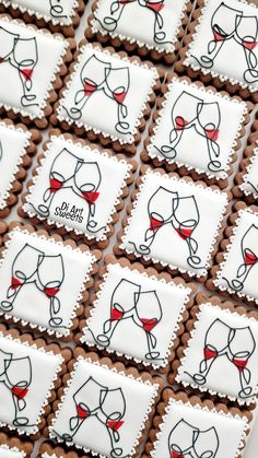 some cookies with wine glasses on them are arranged in the shape of square ones,