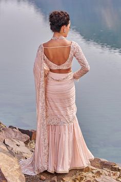 This signature fish cut drape embellished sari in crepe is paired with embroidered sweetheart neck blouse in silk. The blouse is padded and have a back hook closure Sequinned Saree, Sweetheart Neck Blouse, Fish Cut, Reception Saree, Pink Fish, Eternal Beauty, Indian Wedding Wear, Indo Western, Sweetheart Neck