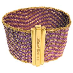 From designer Carolina Bucci, her design style really shows in this beautiful bracelet. This has never been worn, and you can't find it any more! 18 karat yellow gold woven with purple silk strands in a wavy chevron pattern. Bracelet has a concealed closer with "Caroline Bucci" stamped as well as her signature bees. Approximately 6.5 inches long and over 1.5 inches wide. Original tag attached. Chevron Pattern Bracelet, Gold Woven Bracelet, Carolina Bucci, Pattern Bracelet, Woven Bracelet, Woven Bracelets, Purple Silk, Fabulous Jewelry, Chevron Pattern