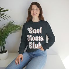 Join the Cool Moms Club with our trendy and stylish t-shirt! Made for all the cool moms out there who are killing it every day. This cool mom shirt is perfect for new moms, seasoned moms, or any mom who wants to show off their coolness. With a comfortable fit and stylish design, this tee is perfect for everyday wear or as a gift for birthdays, Mother's Day, or just because. Made with high-quality materials, this shirt is both durable and comfortable. Join the club and rock your cool mom status w Trendy Long Sleeve Tops With Funny Text, Trendy Slogan Tops For Gifts, Black Casual Sweatshirt Gift, Trendy Tops With Funny Text For Mother's Day, Casual Mother's Day Slogan Sweatshirt, Casual Slogan Sweatshirt For Mother's Day, Casual Slogan Tops For Birthdays, Casual Slogan Tops For Birthday, Casual Sweatshirt For Birthday And Mother's Day