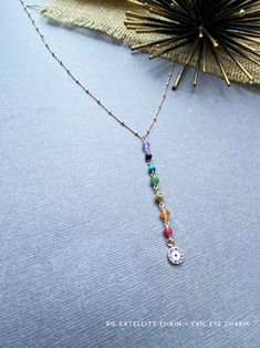 These dainty gemstone Chakra necklace is designed with seven different gemstones, each symbolizing the seven energy points in your boyd. Each of the gemstones has its healing powers and is believed to render physical, mental, and spiritual benefits. From bottom to top, this strand includes Ruby, carnelian, pyrite, emerald, turquoise, lapis lazuli and amethyst. ---------------------------------------- + How to Make Your Necklace + Choose your Chain: - SATELLITE CHAIN: 1. 18K Rose gold over 925 st Rainbow Spiritual Necklace For Meditation, Bohemian Rainbow Crystal Necklaces For Healing, Multicolor Spiritual Necklace With Adjustable Chain, Spiritual Pendant Charm Necklace With Gemstone Beads, Spiritual Multicolor Necklace With Adjustable Chain, Multicolor Spiritual Necklaces With Adjustable Chain, Spiritual Rainbow Necklace As Gift, Spiritual Rainbow Necklaces For Gifts, Spiritual Rainbow Necklace For Gift