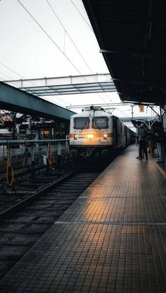 the train is stopped at the station waiting for passengers to get on or off it