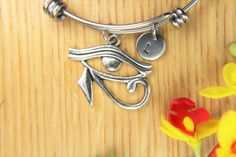 "♥ Eye of Horus Bangle Eye of Horus Bracelet Egyptian Pendant Eye of Horus Gift Personalized Bracelet Expandable Bangle Initial Bracelet ♥ This is a silver-tone Eye of Horus charm with hand stamped initial charm on an expandable bangle ♥ You will receive 1 bangle ♥ Eye of Horus charm 33(12/8\")x(26(1\")mm. ♥ Initial charm stainless steel 10mm choose from a drop-down menu. ♥ Bangle 57-64 mm ♥ additional initial https://www.etsy.com/listing/766732811 ♥ We strive for next day shipping, but we do no Spiritual Metal Charm Bracelet As Gift, Spiritual Metal Charm Bracelet For Gift, Spiritual Metal Bangle As Gift, Handmade Adjustable Stainless Steel Charm Bracelet, Nickel-free Symbolic Metal Bracelets, Spiritual Stainless Steel Bracelets As Gift, Spiritual Stainless Steel Bracelet As Gift, Spiritual Stainless Steel Bracelet For Gift, Spiritual Stainless Steel Bracelet Gift