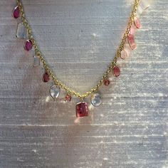 "Featuring 9 carats of  natural and earthmined tourmaline , and 10 carats of natural pink kunzite. The gems are set in a multi shape design, alternating in bezel settings dangling from a 14K yellow gold rolo chain. The gems span 7.5\" long, and the necklace is 16\" around. The heart is .75x.50\" , weighing 9 carats in total A one of a kind piece Marked 14K 10.2g" Luxury Multi-stone Pink Gemstones, Luxury Pink Multi-stone Gemstones, Luxury Pink Morganite Jewelry, Luxury Tourmaline Gemstones With Gemstone Accents, Elegant Multi-stone Pink Sapphire Jewelry, Luxury Pink Gemstones For Gift, Elegant Pink Sapphire Multi-stone Jewelry, Fine Jewelry Pink Multi-stone Jewelry, Exquisite Pink Sapphire Jewelry