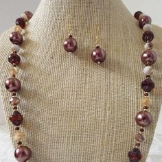 "Bold brown glass pearls, glam crystals and root beer colored turbine beads are the stars in this gorgeous jewelry duo. The necklace is 32\" and is finished with a classic hook closure. The coordinating 12mm pearl  earrings are 1.4\". It's a great gift idea.  All orders come in a beautiful gift box ready for giving along with  a special \"thank you\" gift.  Thank you for sharing my love of jewelry." Brown Necklaces, Big Pearl Necklace, Necklaces Ideas, Big Pearl, Wedding Jewellery Necklace, Gorgeous Jewelry, Root Beer, Beautiful Gift Boxes, Wedding Necklace