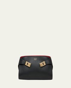 Ferragamo "Hug" shoulder bag in soft leather     Detachable, adjustable shoulder strap     Can be worn as a clutch, shoulder, or crossbody bag     Zip top closure     Adjustable Gancini lift clasp closures on sides     Interior, two card slots     Approx. 5.5"H x 9.4"W x 2.0"D    Made in Italy Zip Top, Leather Crossbody Bag, Cross Body Handbags, Leather Crossbody, Soft Leather, Card Slots, Color Blocking, Slots, Crossbody Bag