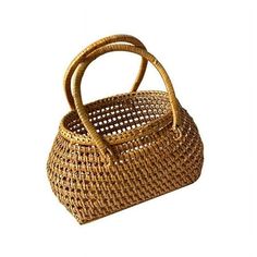 a woven basket with handles on the top and bottom, sitting in front of a white background