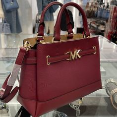 Michael Kors Reed Small Dark Cherry Leather Center Zip Belted Satchel Bag Purse Nwt Authentic The Bag To Carry Everywhere: Meet The Reed Satchel. Designed With Both A Top Handle And Removable Crossbody Strap For Added Versatility, It’s Crafted From Two-Tone Pebbled Leather And Finished With A Belted Accent Featuring Our Mk Hardware. Its Roomy Interior Includes Two Pragmatic Pockets And A Zipper Closure To Keep Your Everyday Essentials Organized. Satchel Pebbled Leather 100% Leather Trim: 60% Pol Ladies Handbags, Satchel Bag, Everyday Essentials, Crossbody Strap, Purple Gold, Leather Trim, Michael Kors Bag, Satchel Bags, Pebbled Leather