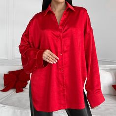 Elegant red satin asymmetrical shirt will complete your stylish look!  Our blouse with a straight collar is fastened with buttons and has slits on the sides that allow you to wear the blouse in different ways, tucking the front in or tying the ends in a knot.  The shirt can be combined with various bottoms, trousers, skirts, jeans or shorts and worn casually for every day, office, school, business look or for special occasions.   DETAILS  - red - satin  - asymmetric hem  - straight collar  - dropped shoulder line  - buttoned     SIZES   This shirt is available in 2 sizes S-M and L-XL   Back length 29.52"/ 75 cm  Dropped sleeve 17.7"/ 45 cm  Shoulder 12.79"/ 32.5 cm  S-M BUST 34-36"/ 88-92cm WAIST 26-28"/ 67-71 cm HIPS 37-39"/ 96-100 cm  L-XL  BUST 37.7-39 inches / 96-100cm WAIST 29.5-31 in Long Sleeve Blouse Outfit, Satin Shirts For Women, Satin Blouse Long Sleeve, Chemise Satin, Bishop Sleeve Blouse, Corporate Shirts, Silk Long Sleeve Blouse, Shirt Elegant, Asymmetrical Shirt