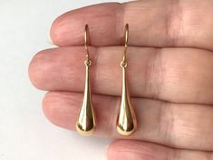 18ct Gold over Sterling Silver Long Teardrop Earrings dimensions: 7mm wide x 35mm drop material: 18ct Gold over Sterling Silver. Teardrop Shaped Jewelry With Shiny Finish For Anniversary, Formal Pear-shaped Drop Earrings With Matching Set, Drop Shaped Jewelry With Shiny Finish For Gifts, Hypoallergenic Gold Pear-shaped Earrings, Classic Long Drop Teardrop Earrings For Anniversary, Gold Hypoallergenic Pear-shaped Jewelry, Modern Pear-shaped Drop For Formal Occasions, Modern Pear Shaped Drop For Formal Occasions, 14k Gold Drop Teardrop Earrings