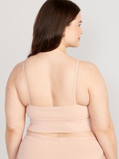 adjustable straps scoop neck 2-ply shelf bra provides light support for a-c cups fitted hits just below ribcage XS = 34A, 32B cup sizes; S = 32C, 34B, 36A cup sizes; M = 34C, 34D, 36B, 36C, 38B cup sizes; L = 34D, 34DD, 36C, 36D, 38B, 40B cup sizes; XL = 38DD, 40D, 40DD cup sizes; XXL = 42D, 42DD cup sizes.  models are approx.  5'9" and wear sizes s (4), l (12), and xl (18)machine wash according to the care instruction label Brami Top, Top Hits, Cup Sizes, Rib Cage, Shelf Bra, Old Navy, Scoop Neck, Adjustable Straps, Plus Size