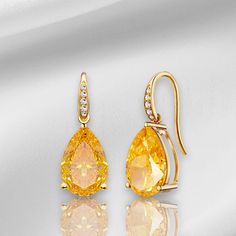 💎 Jewelry Details: *Metal: 14K Solid Gold *Gemstone:    - Type: Citrine    - Cut: Pear    - Color: Yellow    - Clarity: Eye-Clean    - Size: 8 x 10 mm    - Total Carat Weight (CTW): 5.20 *Diamonds:    - Color: Gold   - Clarity: VS    - Total Carat Weight (CTW): 0.05 *Measurements:    - Length: 3/4 inch    - Width: 1/2 inch 🪄 Pear-Cut Meaning:  The Pear-Cut is renowned for its timeless elegance and sophistication. Characterized by its teardrop shape and unique facets, this cut highlights the cl Formal Yellow Gold Earrings With Gemstone Accents, Luxury Yellow Teardrop Earrings, Yellow Earrings With 17 Jewels For Formal Occasions, Formal Yellow Earrings With 17 Jewels, Elegant Formal Citrine Earrings, Luxury Gold Topaz Earrings, Yellow Gold Briolette Teardrop Earrings For Formal Events, Yellow Gold Briolette Teardrop Earrings For Formal Occasions, Yellow Gold Teardrop Briolette Earrings For Formal Occasions