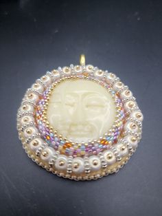 A 1/4 and full moon sleep peacefully on this pendant surrounded by baroque 6/0 beads and colorful seed beads. Cabochon made by Terry Braglin. Bohemian Beaded Necklaces With Pearl Pendant, Spiritual Beaded Pendant Necklace, Amulet Style Beaded Necklaces With Large Pendant, Amulet Style Beaded Necklace With Large Pendant, Pendant Beaded Necklace For Meditation, Sleep Peacefully, Augusta Ga, By Terry, Moon Phases