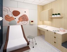 a hospital room with a bed, desk and shelves on the wall next to it