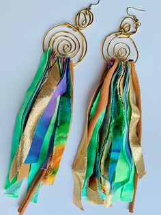 These hand crafted multi-color fabric earrings were inspired by and created for artistic women who value unique and creative self-expression - Each earring is crafted with 16 gauge premium copper gold wire into 2 golden swirls and multi-colored, cotton, knit, polyester, silk and rayon shredded fabric pieces are woven through the bottom - Each type of fabric is carefully selected with artistic eyes to compliment and bring out the radiant color dynamic and pattern of the unique fabrics -  We accep Handmade Bohemian Multicolor Wrap Earrings, Artsy Green Earrings For Festival, Artsy Green Earrings For Party, Green Artsy Earrings For Party, Artistic Green Earrings For Festival, Bohemian Green Wrap Earrings, Diy Yarn Earrings, Shredded Fabric, Cloth Earrings