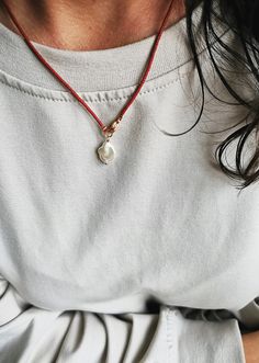 Red beaded necklace with a unique pearl pendant. The pendant is made of small, high-quality Miyuki beads. The beads are very tiny about 1.5mm in size.  A modern and minimalist necklace suitable for wearing alone or goes well with other necklaces. Pearl size ~ 1x1,5cm Necklace will come in a gift box with brand logo and contact card inside the package. It is ready to be given as a gift or somewhere handy for you to keep it safe. The item will be shipped with a registered priority post. If you have any questions please contact me. ---------- Red pearl necklace, Minimalist red beaded choker, Simple red beaded necklace, Red pearl pendant, Miyuki beaded necklace, Modern red necklace