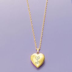 Ross-Simons - Single-Initial - 14kt Yellow Gold Heart Locket Necklace. 20". Make her day with our luxe symbol of love! Crafted in polished 14kt yellow gold, our heart locket necklace is a timeless choice for so many occasions. Suspends from a rope chain. FREE engraving of a single initial in your choice of block or script type. Springring clasp, 14kt yellow gold personalized heart locket necklace. Elegant Heart-shaped Yellow Gold Locket Necklace, Personalized Yellow Gold Locket Necklace For Mother's Day, Personalized Mother's Day Yellow Gold Locket Necklace, Personalized Heart Cut Elegant Locket Necklace, Elegant Personalized Heart Cut Locket Necklace, Elegant Personalized Medallion Heart Necklace, Personalized Medallion Heart Necklace, Elegant Locket Necklace With Hallmark For Mother's Day, Yellow Gold Medallion Locket Necklace For Personalized Gift