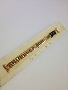 Brand New Expertly Crafted Vintage Gemex Gold-Tone Stretch Bracelet Watch Band. 13mm  Fancy Link Stretch Bracelet Band w/ Elegant Lugs. Made In U.S.A. Approx. 5 1/2" length before being stretched. Comes in original Gemex Watch Display. Discovered these Vintage Watch Bands in watchmakers old shop inventory and listed them at extremely low prices, will enrich any timepiece!!! USPS FIRST CLASS MAIL INSURED W/ TRACK #. Please check my other auctions for more Brand Name Luxury & Vintage watch bands in several different colors & sizes. Classic Gold Band Bracelet, Gold Bracelet Strap Watch Bands For Formal Occasions, Adjustable Gold Metal Watch Bands, Antique Gold Bracelet Strap Jewelry, Vintage Gold Watch Bands For Formal Occasions, Classic Gold Jewelry And Watches With Bracelet Strap, Timeless Metal Gold Bracelet, Gold Adjustable Watch Extender, Vintage Gold Bracelet With Bracelet Strap As A Gift