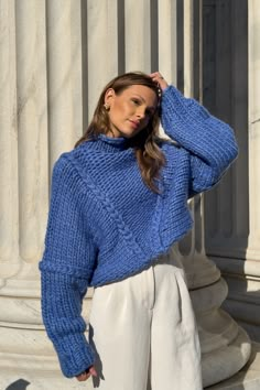 Be warm & cozy with the Jessa Chunky Sweater in a beautiful dark cerulean blue. Made with chunky knit yarn, this sweater hits at the waist for a flattering and cozy fit. Hand knit chunky yarn construction Braided accents creating shape Dark cerulean blue Balloon sleeves Turtle neck Made with 20% wool and 80% recycled acrylic Your order will ship from our warehouse in FL, USA! Luxury Blue Knit Sweater, Luxury Blue Sweater For Fall, Wool Blue Sweater, Luxury Oversized Blue Sweater, Luxury Blue Soft Knit Sweater, Luxury Blue Textured Knit Sweater, Loose Turtle Neck Sweater, Chunky Navy Blue Sweater, Azure Blue Sweater