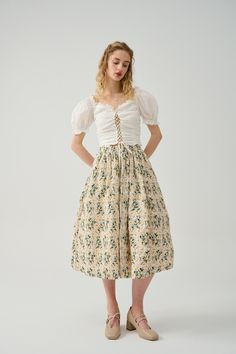 Feminine Midi Length Skirt For Garden Party, Floral Embroidered Full Skirt For Summer, Floral Embroidered Full Skirt Bottoms, Floral Embroidered Full Skirt For Spring, Flowy Full Skirt With Floral Embroidery, Knee-length Floral Print Skirt For Garden Party, Elegant Cotton Skirt With Floral Embroidery, Fitted Skirt With Floral Embroidery, Spring Floral Print Voluminous Skirt