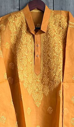 "-Chikankari kurta for men. -Fine hand embroidery on a soft cotton. \"Please note the sizes mentioned are actual garment measurements\"" Traditional Yellow Kurta With Intricate Embroidery, Yellow Kurta With Intricate Embroidery For Festivals, Yellow Kurta With Intricate Embroidery For Transitional Season, Ceremonial Cotton Sherwani With Cutdana, Bollywood Style Cotton Sherwani For Ceremonial Occasions, Ceremonial Cotton Kurta With Chikankari Embroidery, Ceremonial Cotton Kurta With Zari Work, Traditional Festive Kurta With Chikankari Embroidery, Ceremonial Cotton Straight Kurta