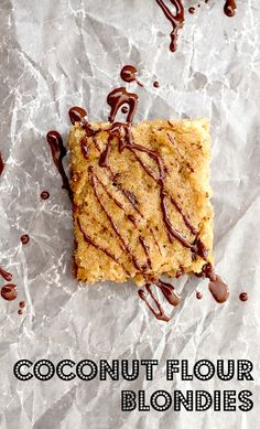 coconut flour blondies with chocolate drizzled on top and the words coconut flour blondies