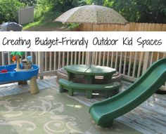 a kid's play area with an umbrella, table and bench in the background