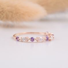 Small & dainty 14k rose gold marquise cut purple amethyst womens wedding band, Tiny delicate vintage art deco amethyst wedding ring WE OFFER UNLIMITED PERIOD INSTALLMENTS PLAN This is a beautiful, stunning, feminine ring that works well for all occasions, styles, and ages. You will love it! Ring information: Stones: White cubic zirconia Approximate size: 4x2mm (4 stones) Stones: Amethyst Approximate size: 2.0mm (5 stones) Metal type: Gold Metal stamp: 14k Gold Installment Payments We offer i Amethyst Wedding Ring, Amethyst Wedding Rings, Simple Wedding Bands, Amethyst Wedding, Fancy Gifts, Etsy Wedding Rings, Gem Ring, Purple Band, Womens Wedding Bands