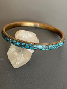 Inlaid Stone and brass bangle | Vintage Tribal Stacking Bracelet | Blue Mosaic Cuff | Boho Artisan Measures 2.5" across  7.75" on the bracelet mandrel Blue stone chips inlaid / brass inside of bangle  Check out my shop for more vintage jewelry and clothing! https://www.etsy.com/shop/sierramadrevintage Blue Ceremonial Bangle Jewelry, Blue Ceremonial Bangle, Adjustable Artisan Blue Bangle, Artisan Blue Bangle Cuff Bracelet, Artisan Blue Cuff Bangle Bracelet, Artisan Blue Bangle Bracelets, Artisan Blue Cuff Bracelet For Festivals, Artisan Blue Bangle Bracelet, Artisan Handmade Blue Bangle